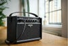 BOSS KATANA-MINI X / KTN-MINI X Guitar Amplifier イメージ図。テーブルの上にKTN-MINI Xが置かれている。
